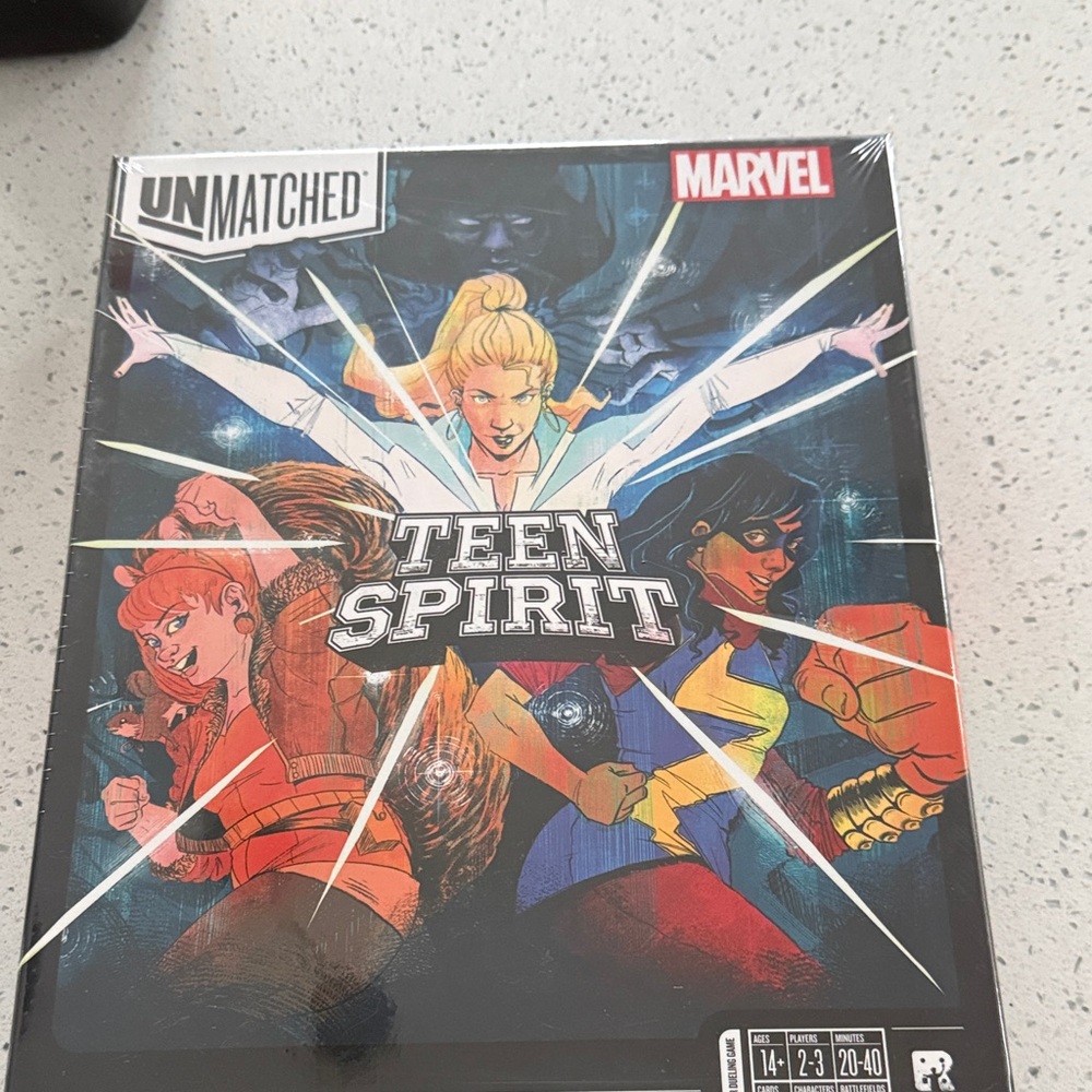Marvel Unmatched Teen Spirit Game with Red, Blue, and Yellow